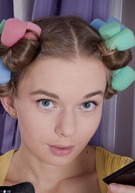 Teen chick undresses and stimulates clit of bushy pussy while pin-curling hair