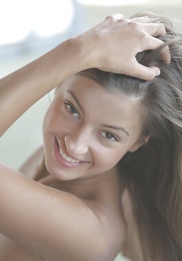 Pretty student stretches on the mat and gets naked appreciating body in mirror