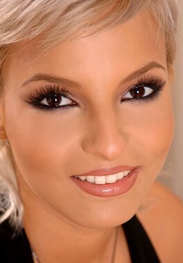 Female with black eyes knows she is sultry and agrees to take part in XXX shoot