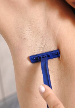 Female with red hair shaved her cherry without taking black stockings off