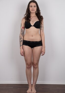 Small-tittied tattooed chick wants to boast about her tattoo sleeve in the studio