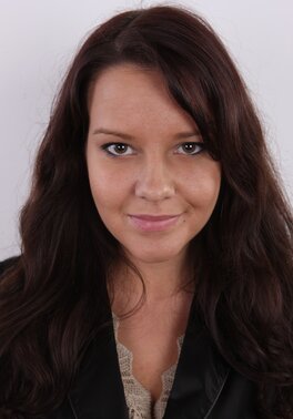 Young woman feels a little bit shy to show off her natural tits on camera