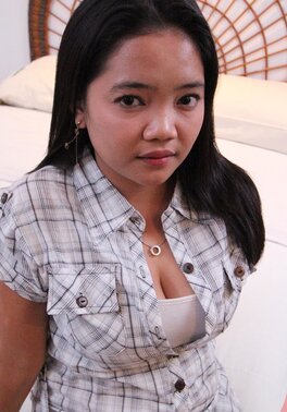 Asian chick in a checkered shirt sucks and gives hairy cunt to boy for drilling