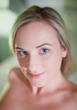 Shy slender blonde in stockings gives hot close-up of her pussy teasing