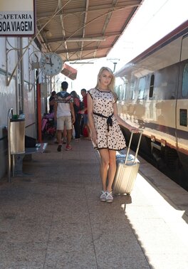 Charming blonde sweetie in dress flashes panties on the railway station