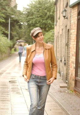 Playful brunette honey pulls off sexy underwear to expose big natural tits