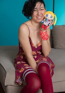 Brunette playing with her pussy and her Sailor Moon toy