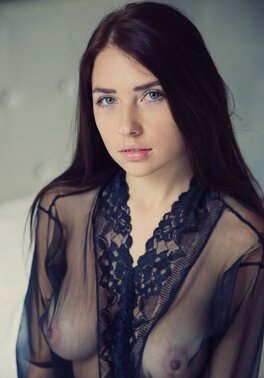 Brunette with nice boobies is showing off her ass and breasts