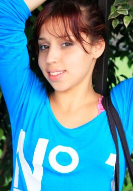 Attractive redhead with a firm behind showing off for the cam