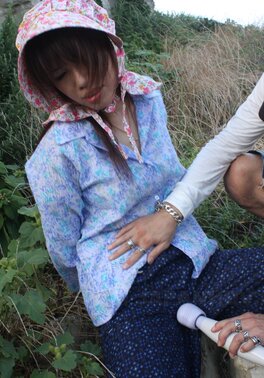 Japanese girl gets pleasured through her pants in rubber boots