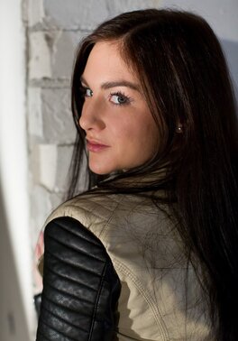 German stunner Lullu Gun strips down to her knee-high socks on a throw rug