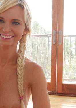 Blonde beauty with blue eyes and a big bum gives a blowjob