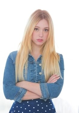 Lucy Tyler demonstrates her shaved pussy and tight ass