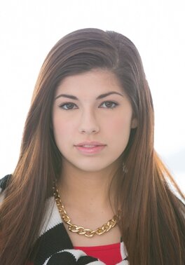 Clothed brunette girl Ava Taylor strips and poses naked