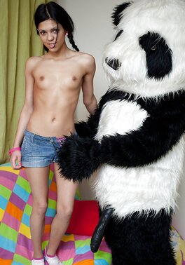 Skinny teen brunette in pigtails strips and plays with her toy