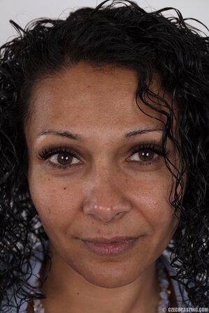 Tanned diva Erin with small boobs heads to porn studio for an obscene photoshoot