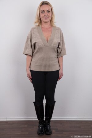 Dirty mature woman has saggy tits and belly but still poses naked in studio