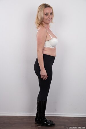 Dirty mature woman has saggy tits and belly but still poses naked in studio