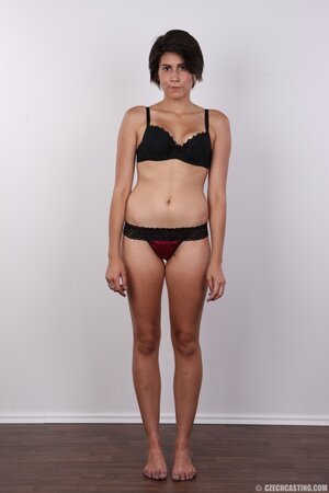 Teen with tuny tits exposes them and tries to hide vagina with hands