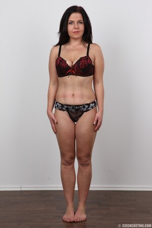 Black-haired woman takes clothes off to show saggy tits and small ass