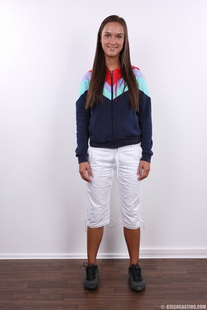 Smiling Czech MILF Barra Brass in short white pants and sweat shirt poses on cam