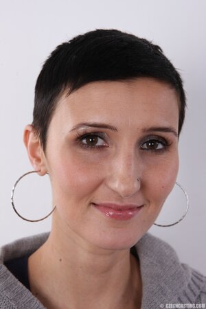 Buzzed slut with round tits exhibits pretty private parts of slender body