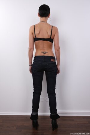 Buzzed slut with round tits exhibits pretty private parts of slender body