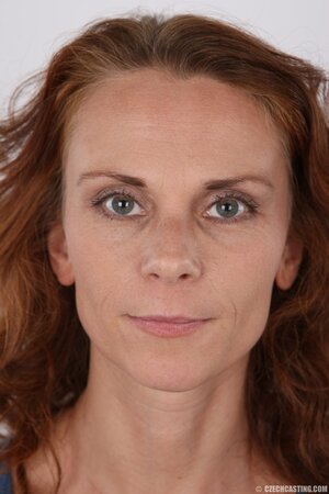 Middle-aged ginger cutie strips naked exposing her unremarkable charms