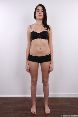 Chick with black eyes unshrouds breasts getting naked in front of the camera