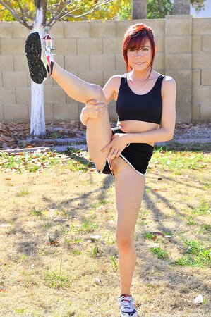 During workout in backyard skinny redhead decides to do yoga without clothes