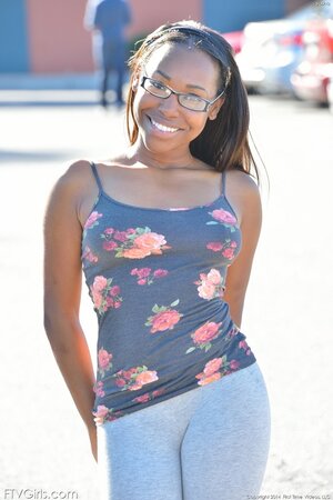 Nerdy black babe Ashton Devine flashes tits and fingers twat in the fresh air