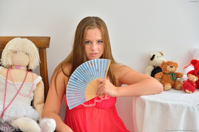 Love in red nightgown and panties has sex toy of the same color for anal play