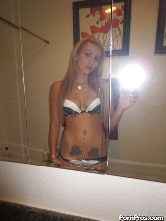 Girl with small boobs and roses tattoo comes to bathroom for taking naked pics