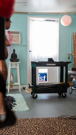 Arousing black girl with fat butt cheeks and fuzzy hair wears tight clothes