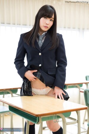 Japanese schoolgirl takes off her panties and shows up her butt in the class