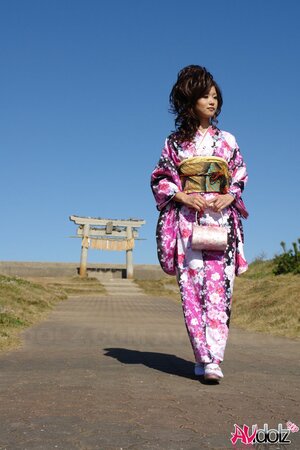 Asian slut knows her business and walks down the ocean shore attracting boys