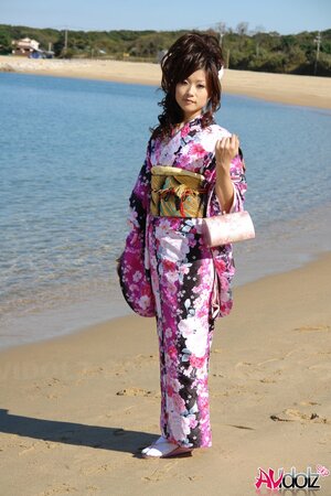 Asian slut knows her business and walks down the ocean shore attracting boys