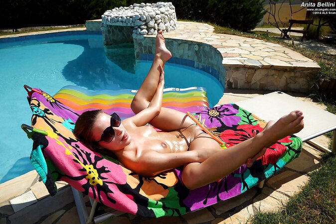 Hungarian chick introduces pussy spreader to her crotch on a sun lounger