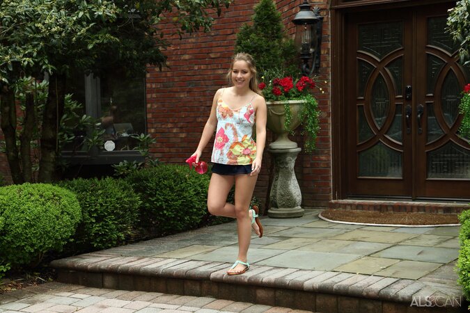 Young minx with small boobs masturbates holes by an outdoor fountain