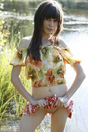 Innocent teen with bangs and slender body flashes tits and pussy by the lake