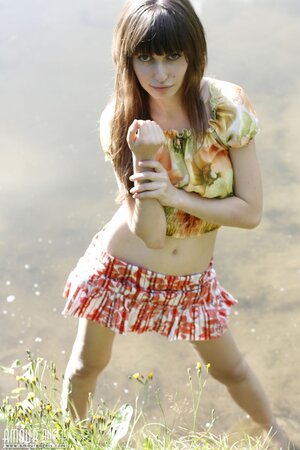 Innocent teen with bangs and slender body flashes tits and pussy by the lake