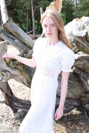 Young angel during walk finds quiet spot perfect to pose naked under the sun