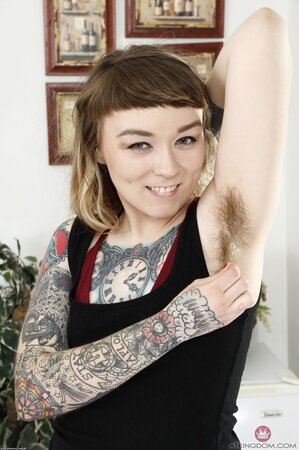 Tattooed alt girl demonstrates her fluffy armpits together with snatch and fanny