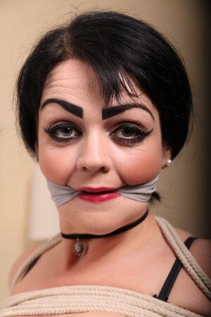 Hot teen with a heavy makeup is easy prey for pervert cause she is hogtied