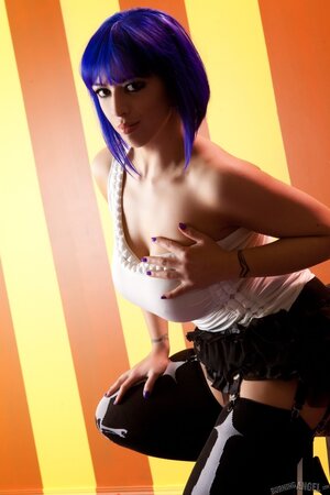 Ornamental girl with violet hair licks her nipple and touches pussy