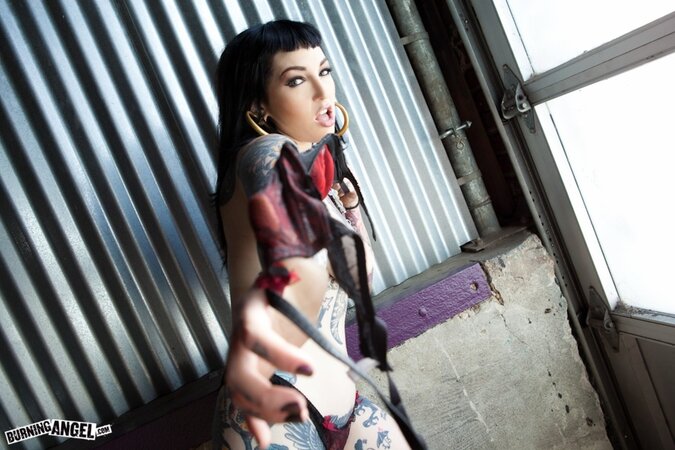 Tattooed brunette with hoop earrings shows how her smooth pussy looks like