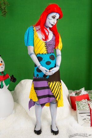 Pornstar with fiery red hair looks fuckable even when cosplaying a zombie