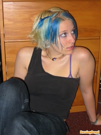 Babe with colorful hair doesn't feel shy to flash her smooth pussy