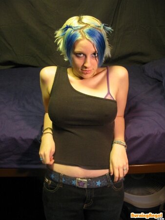 Babe with colorful hair doesn't feel shy to flash her smooth pussy