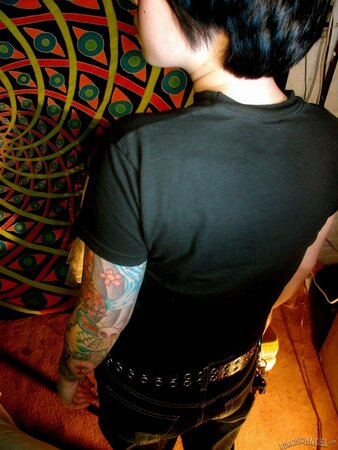 Oriental teen flashes her tattoos all over the petite body in close-up